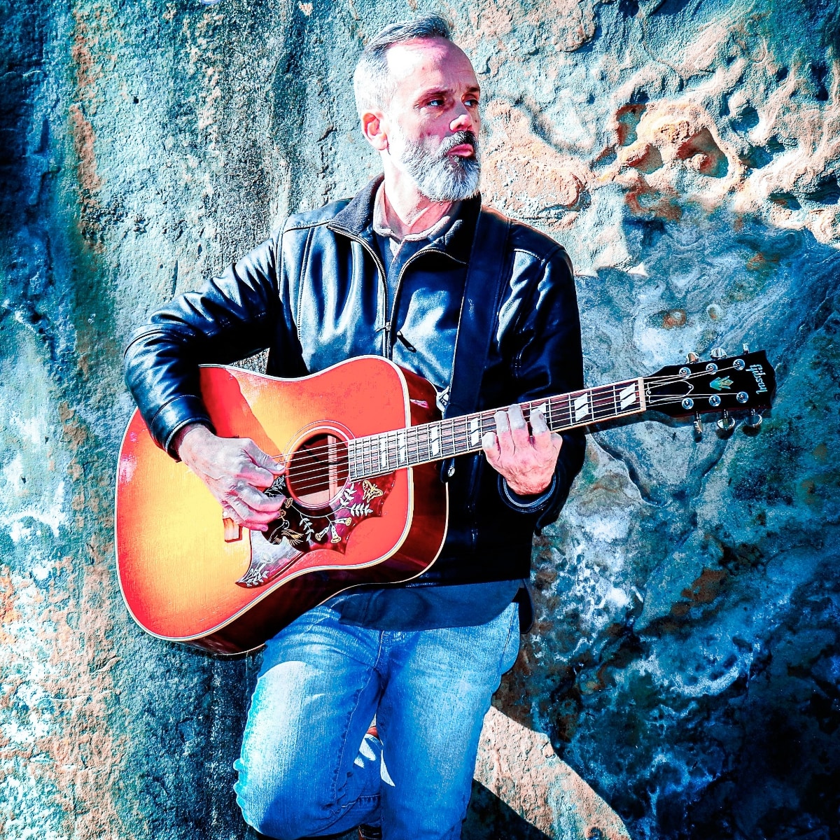 Photo of Eric with guitar