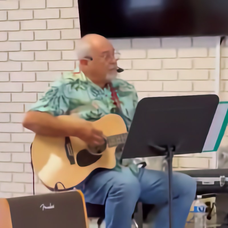 Photo of Danny Pugliese playing guitar