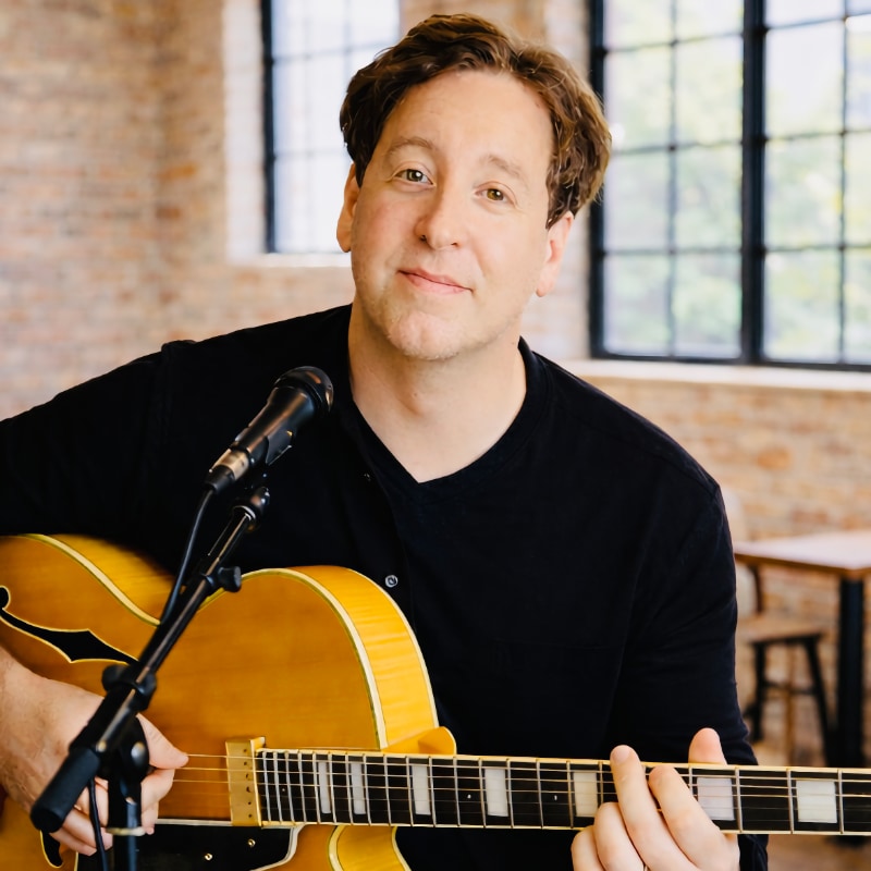 Photo of Seneca Paul Block with guitar