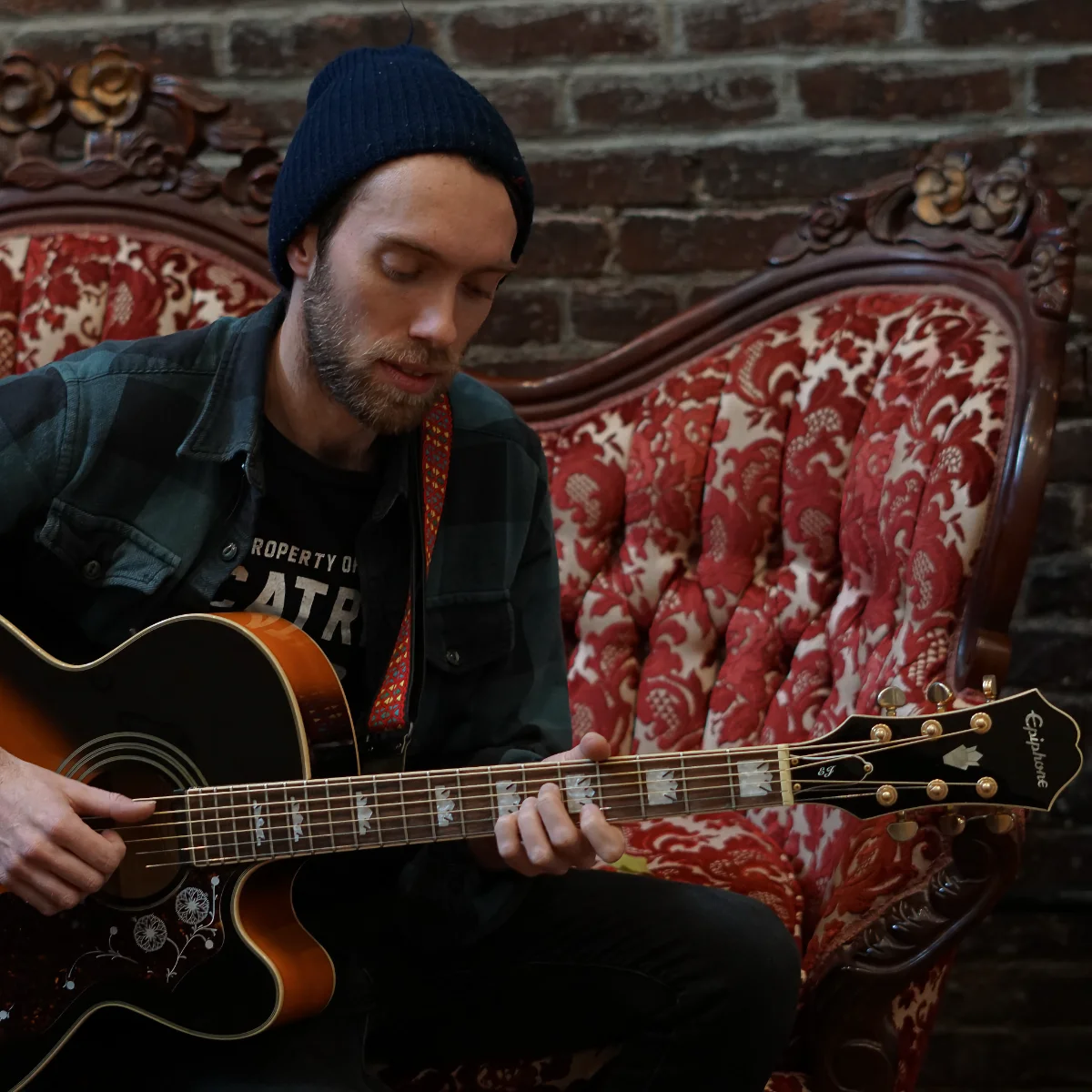 Photo of Daniel playing guitar