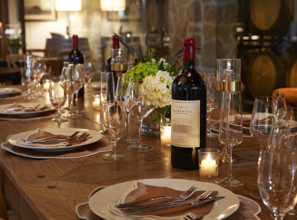 Laurentia Stratum magnum on a candlelit cellar table set for dinner