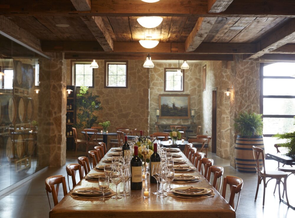 Long table set for a corporate dinner in the Laurentia cellar